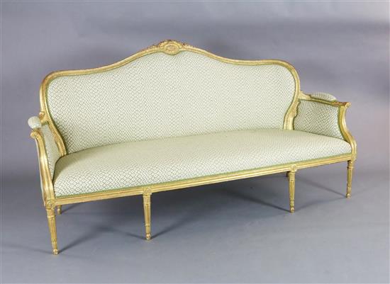 A Louis XVI style giltwood settee, W.6ft 4in. D.2ft 8in. H.3ft 3in.